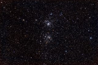 two dense groups of stars in the night sky