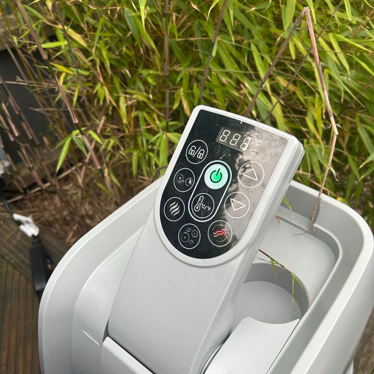 Lay-Z-Spa Miami display screen on pumpwith buttons infront of bamboo