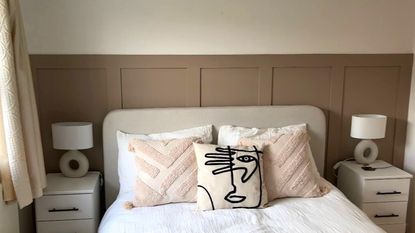 bedroom makeover with pink wall panelling and cushions