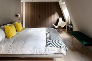 Loft bedroom with built in wardrobe