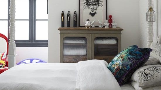 bedroom with white bed and vintage vanity