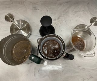 How we test French press coffee makers: the Fellow Clara, Stanley, and Zwilling French presses brewing coffee