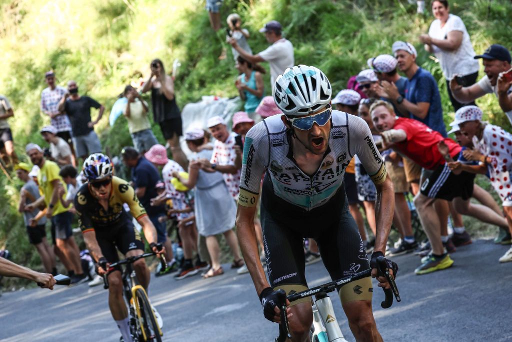 Bahrain - Victorious' Dutch rider Wout Poels (R) and Jumbo-Visma's Belgian rider Wout Van Aert (L) cycle in a breakaway in the final ascent of Saint-Gervais-les-Bains in the last kilometers of the 15th stage of the 110th edition of the Tour de France cycling race, 179 km between Les Gets Les Portes du Soleil and Saint-Gervais Mont-Blanc, in the French Alps, on July 16, 2023. (Photo by Anne-Christine POUJOULAT / AFP)