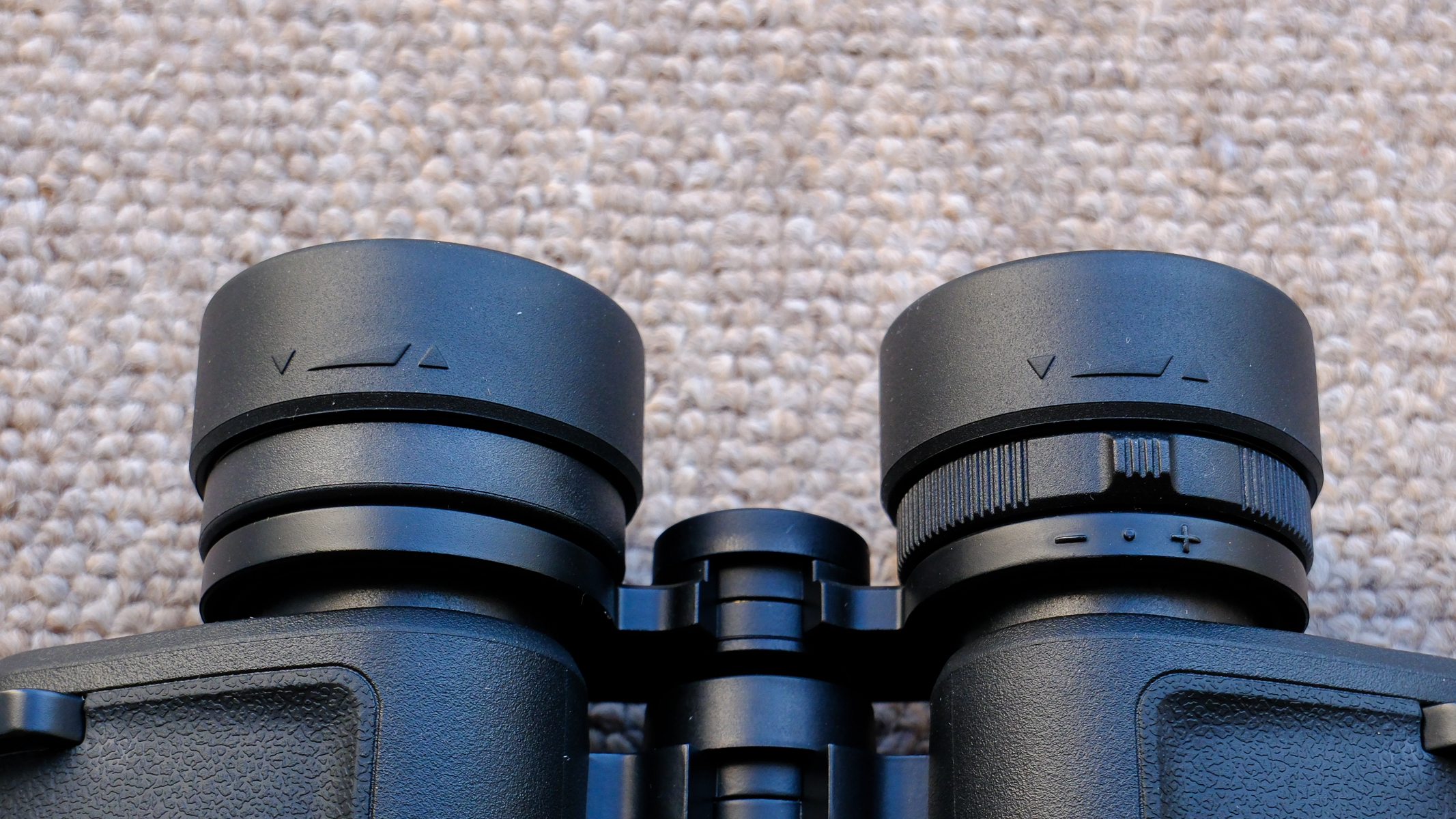 A close-up of the diopter adjustment ring and eyecups on the Nikon Action 7x50 binoculars.