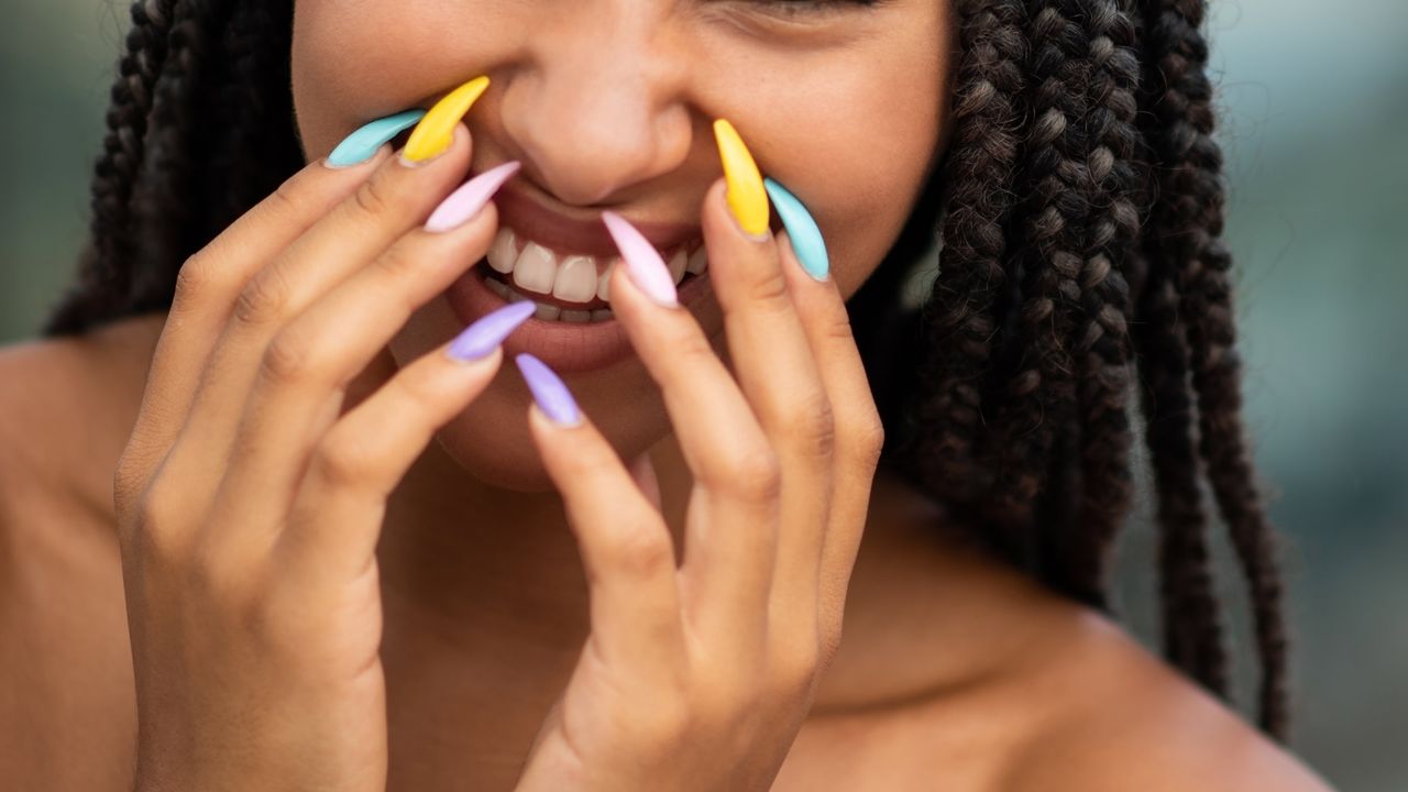 woman with multicolor nails