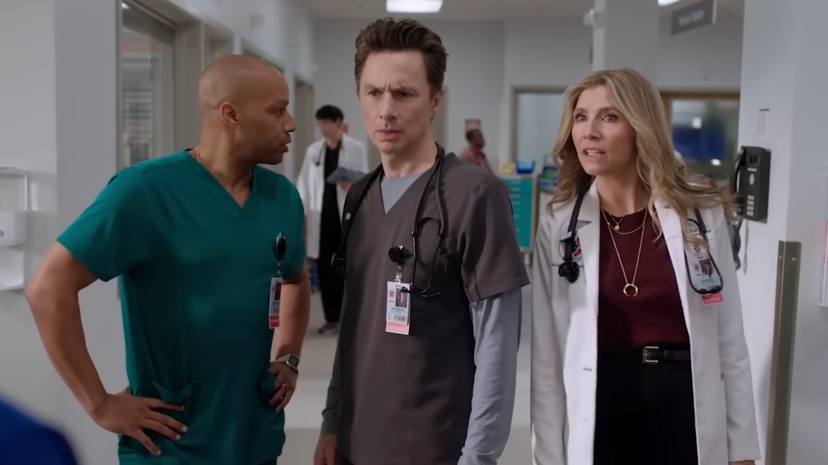 The cast of Scrubs from left to right: Turk (Donald Faison), J.D. (Zach Braff), and Elliot (Sarah Chalke).