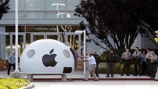 A security official forces his way into the Greenpeace iPod