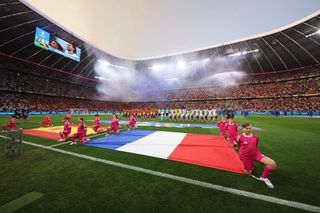 A general view of the inside of the stadium as players of Spain and France line up on the pitch prior to the UEFA EURO 2024 Semi-Final match between Spain and France at Munich Football Arena on July 09, 2024 in Munich, Germany. 