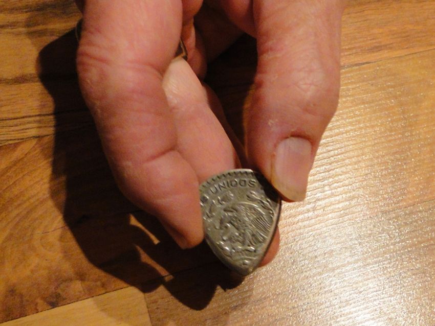 Those are Billy Gibbons' fingers holding his Mexican peso pick