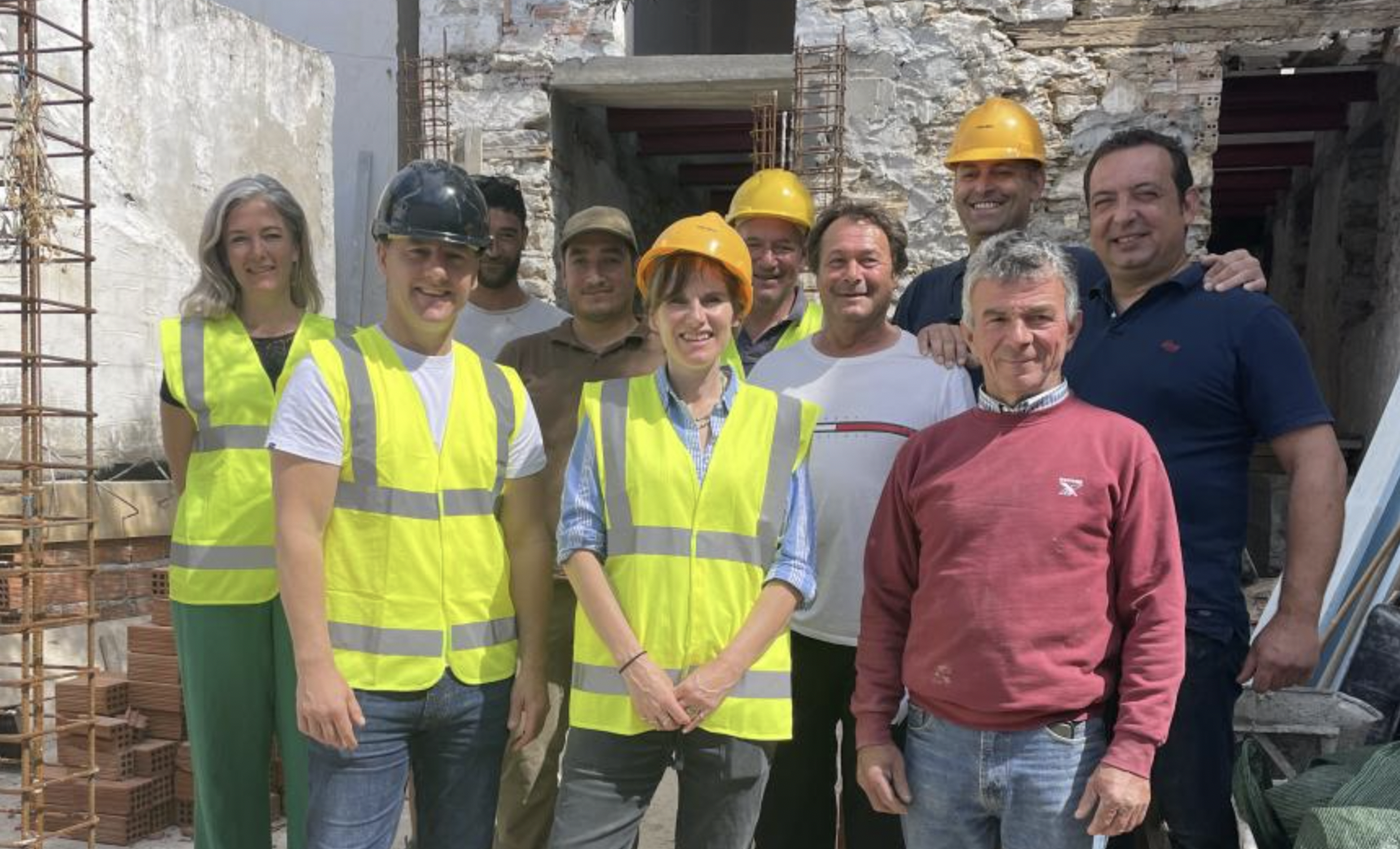 Home Greek Home stars wearing high vis and hard hats