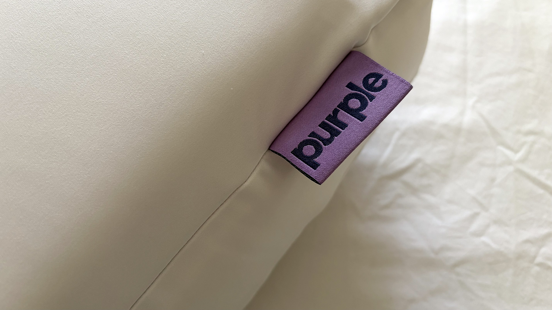 A close up of the Purple tag on the Purple DreamLayer pillow