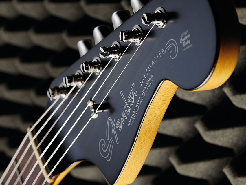 The black-painted headstock gives both guitars a distinctive look