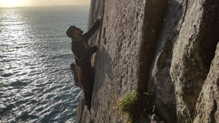 sea cliff climbing: climber