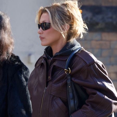 Bella Hadid was spotted in SoHo wearing jeans, a leather bomber jacket, a Saint Laurent bag, and Salomon hiking sneakers