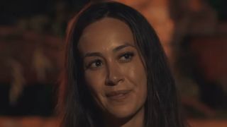 Angelina talks to Jeff during tribal council on Survivor 50.