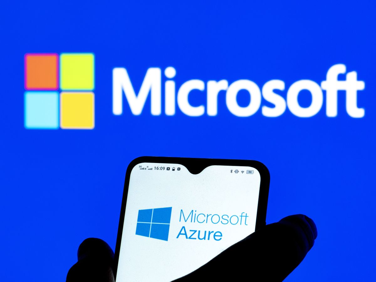 Microsoft Azure logo displayed on a smartphone with Microsoft branding in background