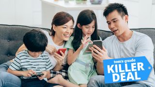 A young family looking at their smartphones with a 'Killer Deal' badge overlaid