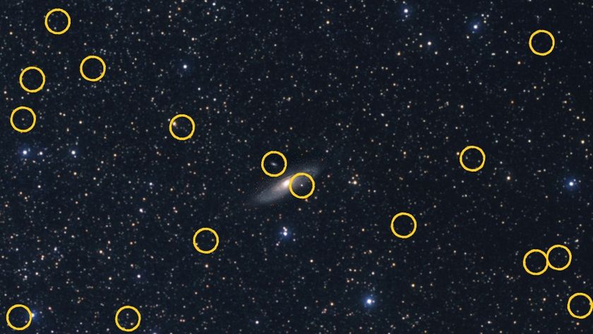 An image of a starry sky with a galaxy in the center. The yellow circles show other galaxies nearby.