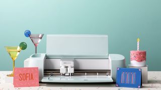 Cricut Explore 3 surrounded by projects