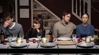 Marlon, Rhona, Tom and Belle look unhappy at the dinner table in Emmerdale 