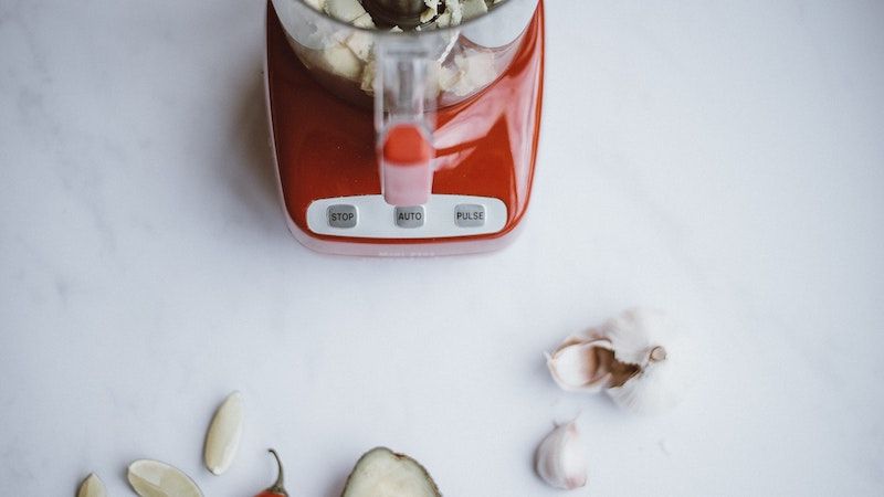 red blender on kitchen counter