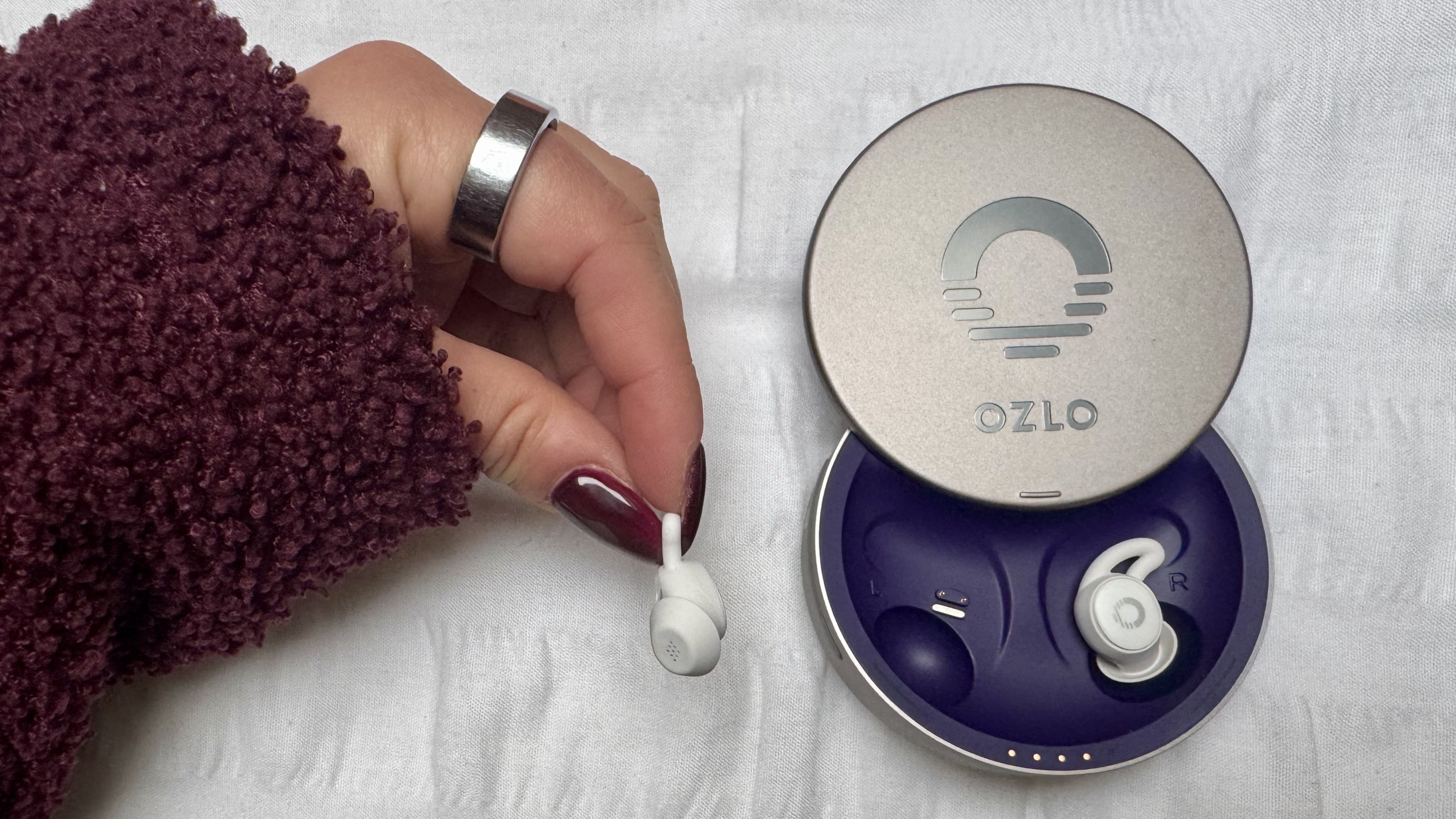 White Ozlo Sleepbuds in purple case