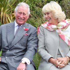 King Charles III and Queen Consort Camilla laughing