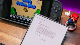 Mario guide within the NotebookLM app on the Galaxy Z Fold 6 with the Nintendo Switch 2 in the background
