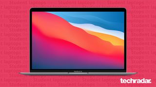 En MacBook mot en rosa bakgrund