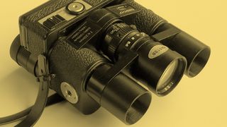 The front of the Tasco 7900 binocular camera on a yellow background