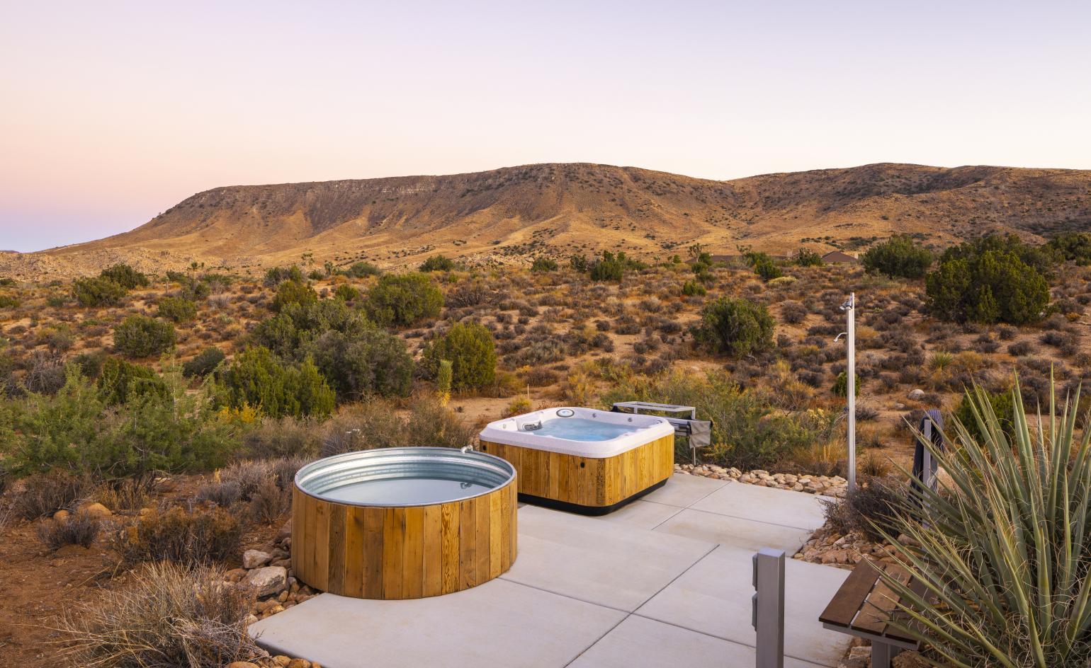 house and its outdoors entertaining options and hot tubs