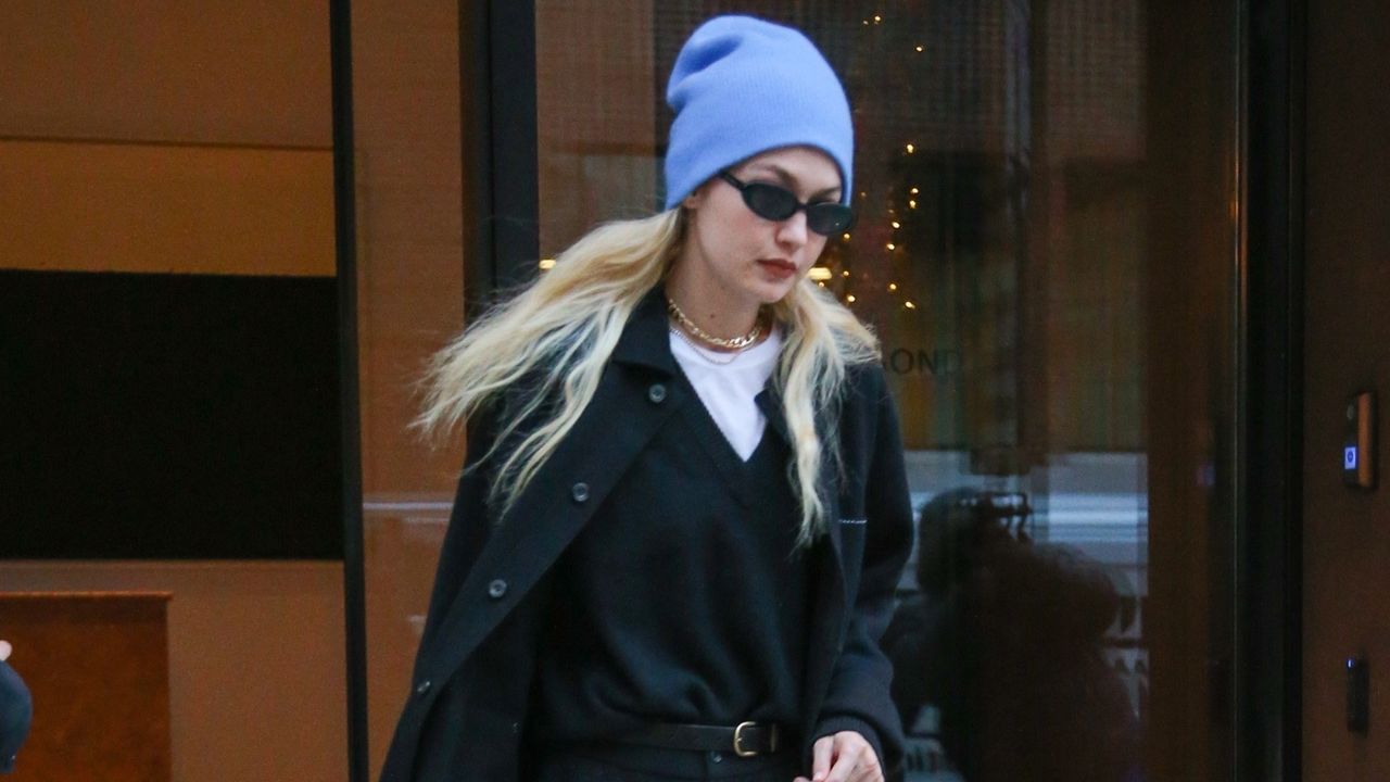 Gigi Hadid in a blue beanie and black outfit