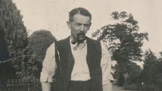 Black and white photo of Ralf Little's maternal great-grandfather Albert Lockley wearing a white shirt and dark waistcoat and smoking a pipe in Who Do You Think You Are?