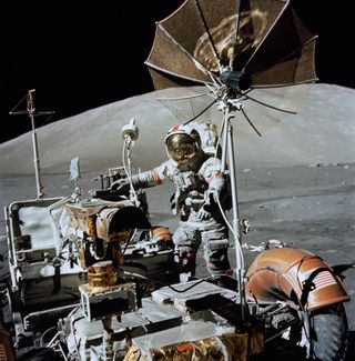 Cernan works at the lunar rover, a vehicle type that was used on the three last Apollo missions (Apollos 15, 16 and 17).