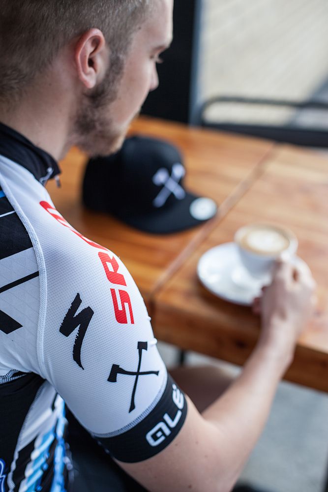 The logo of the team's new bicycle manufacturer, Specialized, is prominently featured on the jersey