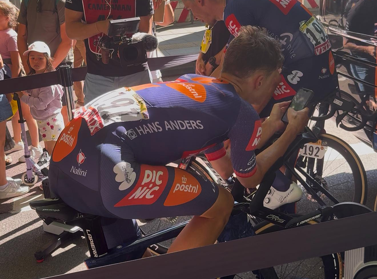 Oscar Onley at the Tour de France on his phone