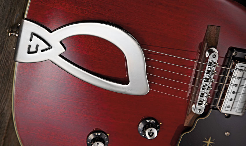 The 'harp' tailpiece is a striking visual motif