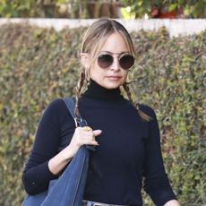 Nicole Richie wearing a black turtleneck