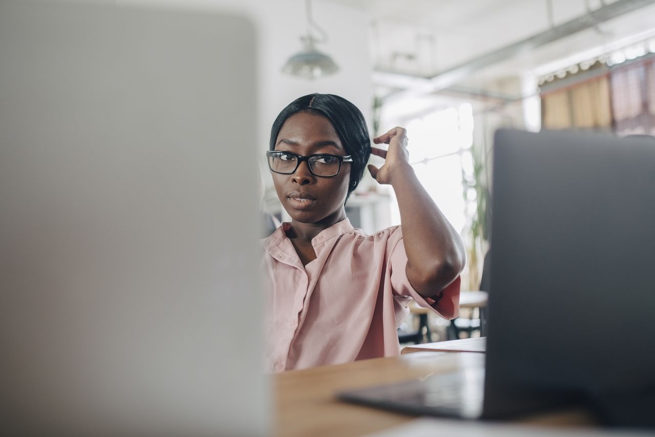 Warped sense of time: A woman looks confused at her desk