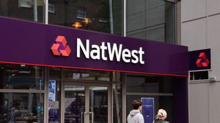 NatWest logo and branding pictured on a storefront in Bishopsgate, City of London.