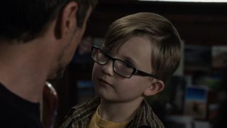 Kid who looks like Ralphie from A Christmas Story looking at Tony Stark