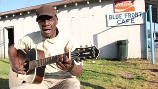 Jimmy 'Duck' Holmes, performs outside his Blue Front Cafe in Bentonia, Mississippi, 2013