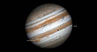 a large jupiter with labeled moons