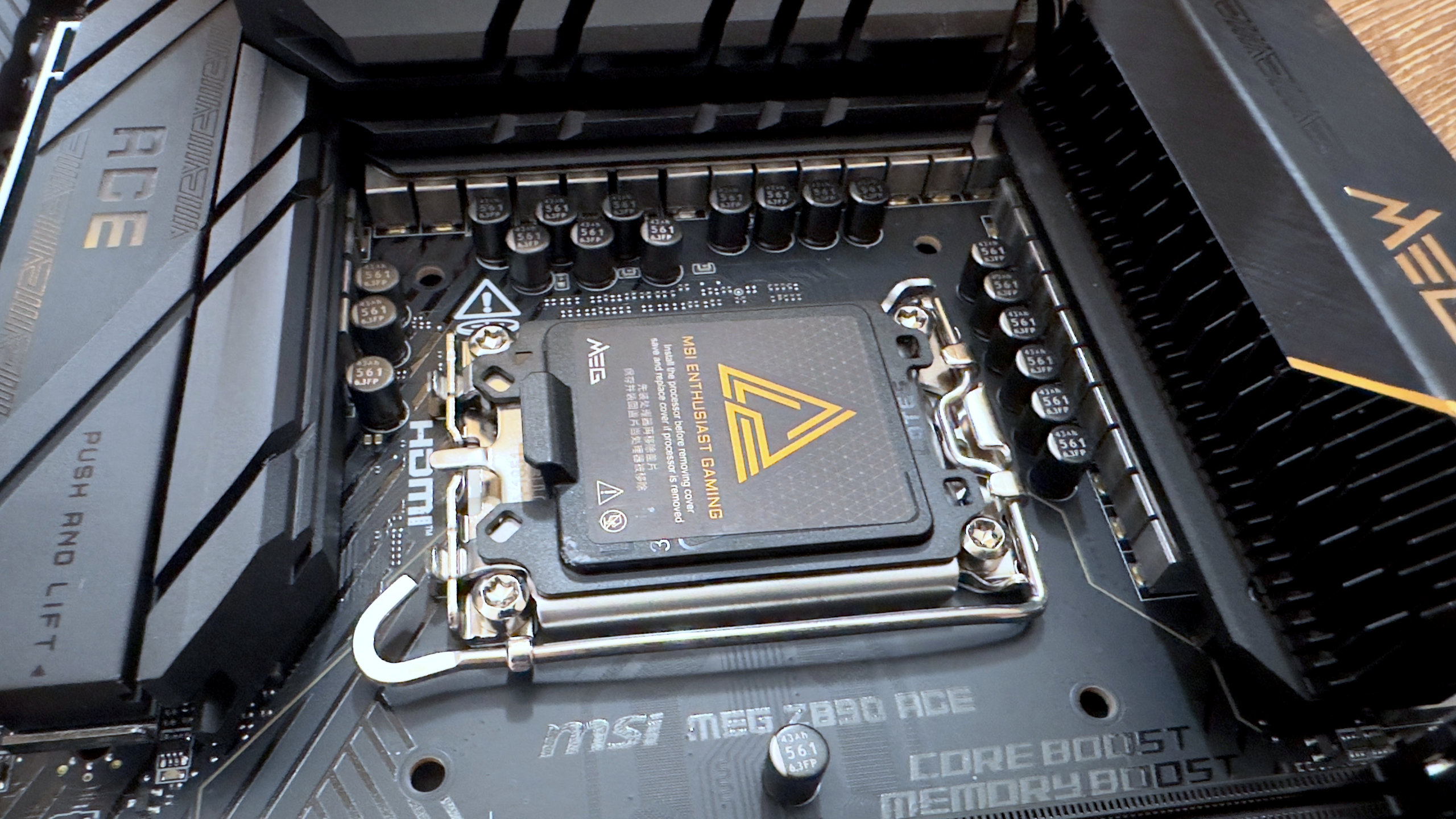 A close-up photo of the MSI MEG Z890 Ace motherboard, focused on the CPU socket.