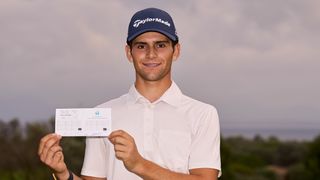 Angel Ayora with his scorecard after shooting a 62 in the Rolex Challenge Tour Grand Final