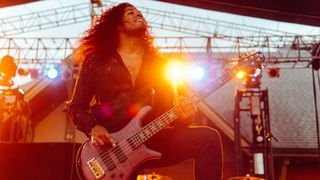 Skyler Acord of Issues performs live with his Spector signature bass