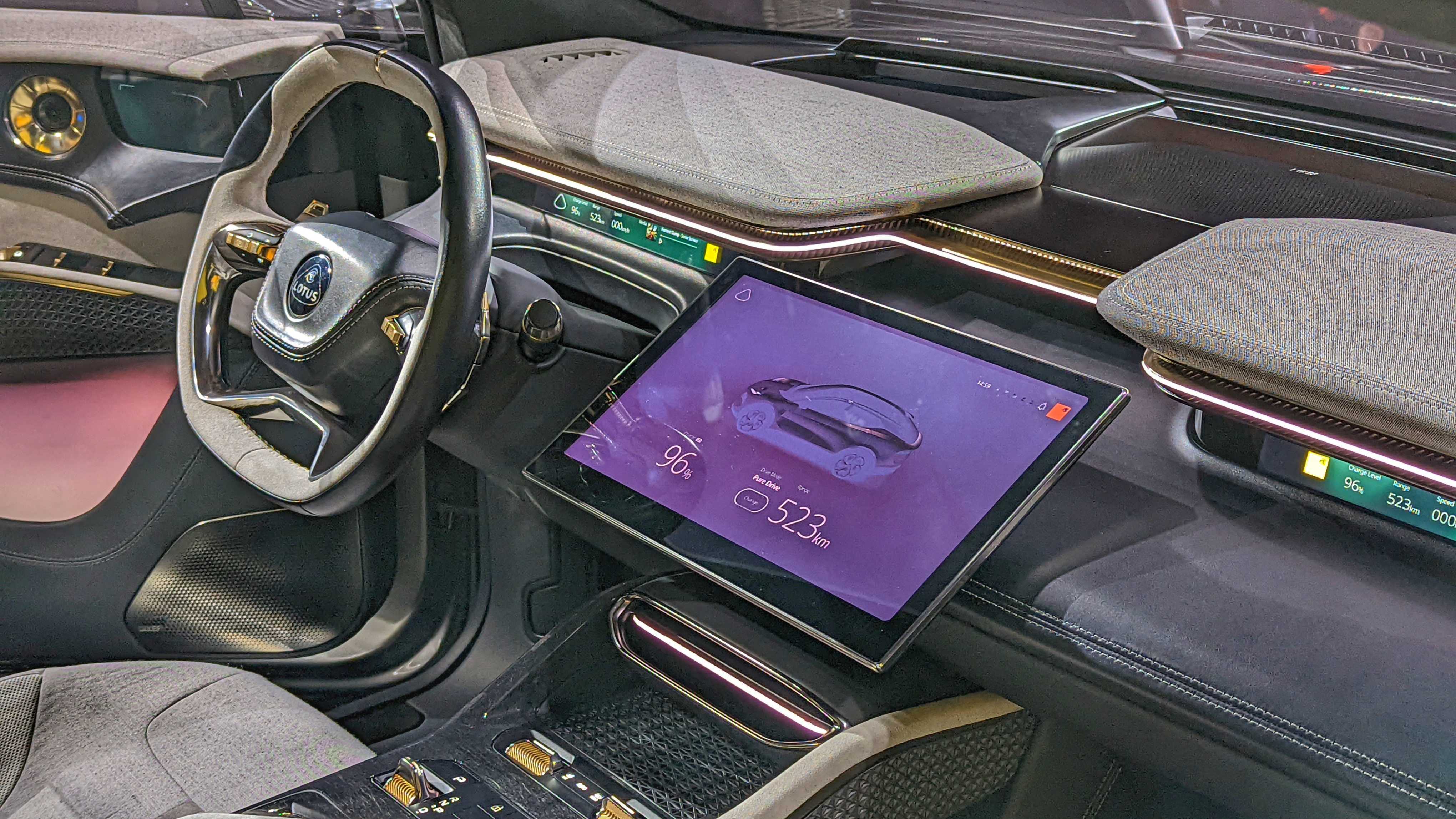 Close-up of steering wheel and central display in the Lotus Eletre