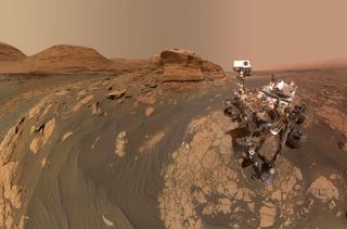 NASA's Curiosity Mars rover used two different cameras to create this selfie in front of a rock outcrop named Mont Mercou, which stands 20 feet (6 meters) tall.