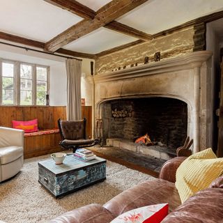 sitting room with fireplace and wooden beam