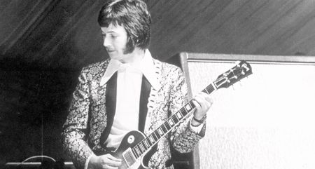 Eric Clapton performing on stage with Cream during their first live appearance in 1966